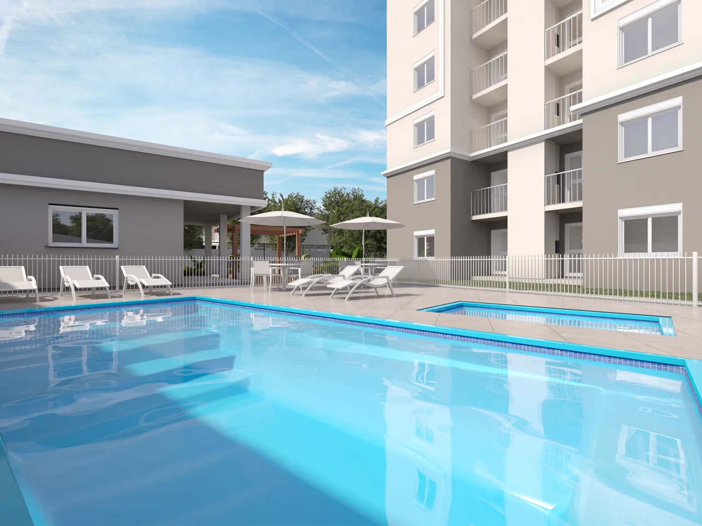 Piscinas adulto e infantil do Residencial Vega Novo Hamburgo com deck e espreguiçadeiras